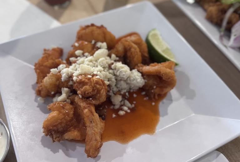 La Camaronera Seafood Joint & Fish Market signature dishes Camaronera's Shrimp
Conch Fritters
The OG Minuta Sandwich